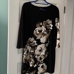 Black dress or tunic with floral design.